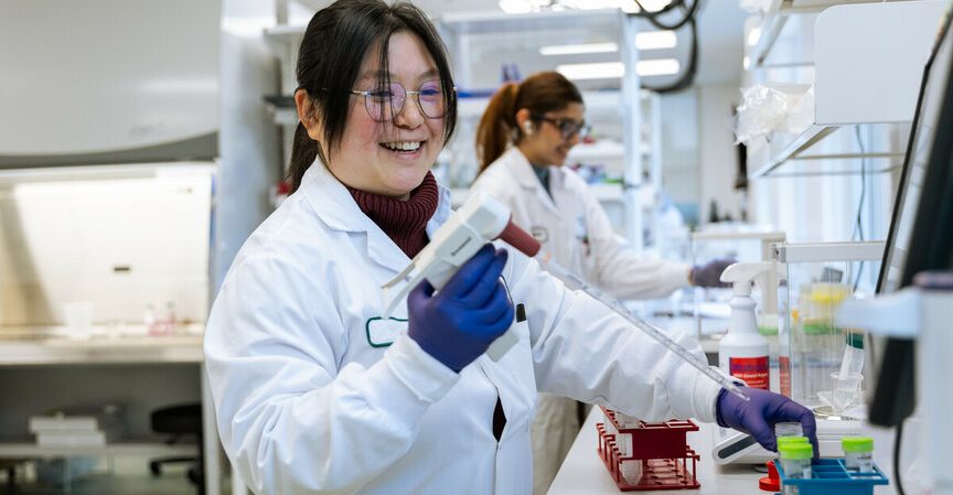 Acuitas scientist works in the lab.